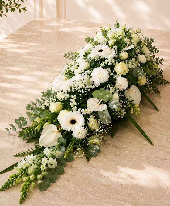 Blanc Éternel — dessus de cercueil funéraire, fleurs de deuil livrées à Toulouse